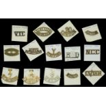 Shoulder titles. A selection of 14 British metal shoulder titles, including Hood Battalion,...