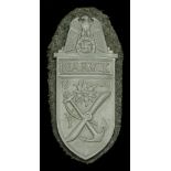 A German Second World War Army Narvik Shield. The grey metal Narvik Shield on army backing...