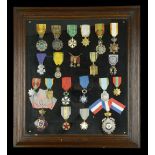 France, A framed display of 20 French and French Colonial Orders, Decorations, and Medals, i...