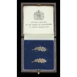 Queen's Commendation for Brave Conduct, two bronze oak leaf emblems, with pin fittings, in C...