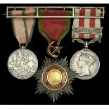 A scarce 'Turkish Contingent' and Indian Mutiny group of three awarded to Captain T. B. Heat...