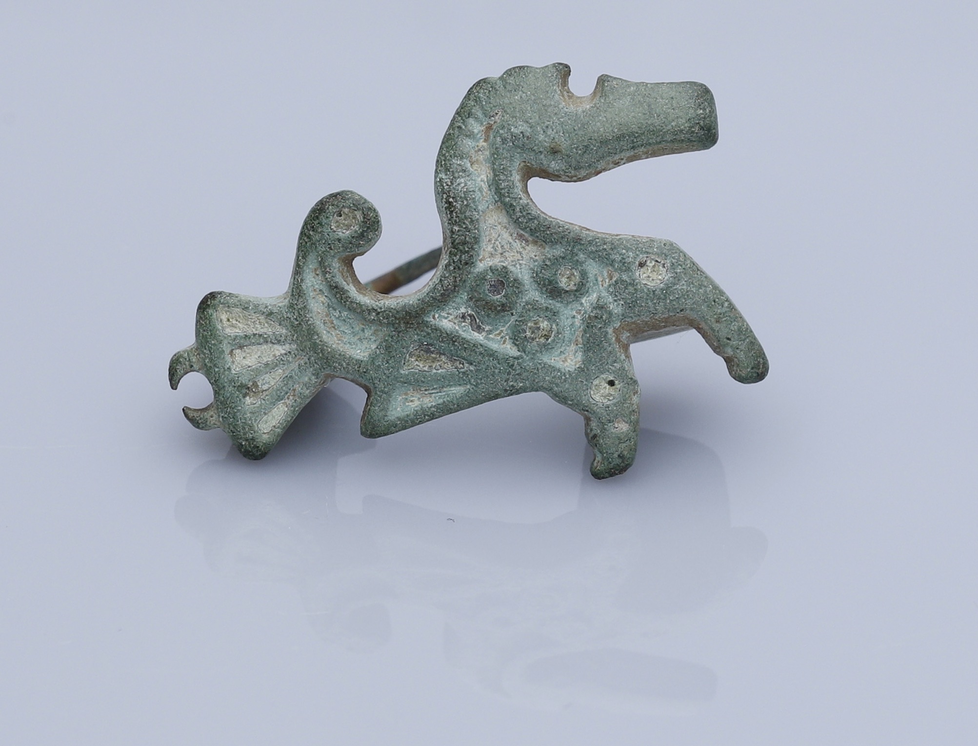 Roman, Romano-British, A bronze Hippocampus plate brooch, 2nd century AD, 28mm long by 20mm...