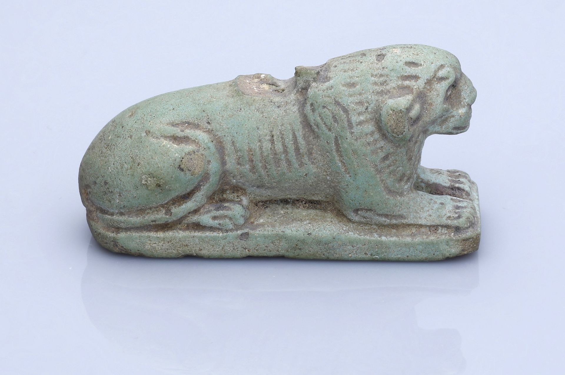 Egypt, Late Period (664-332 BC), A large green glazed faience amulet of a recumbent lion, 4.... - Image 2 of 2
