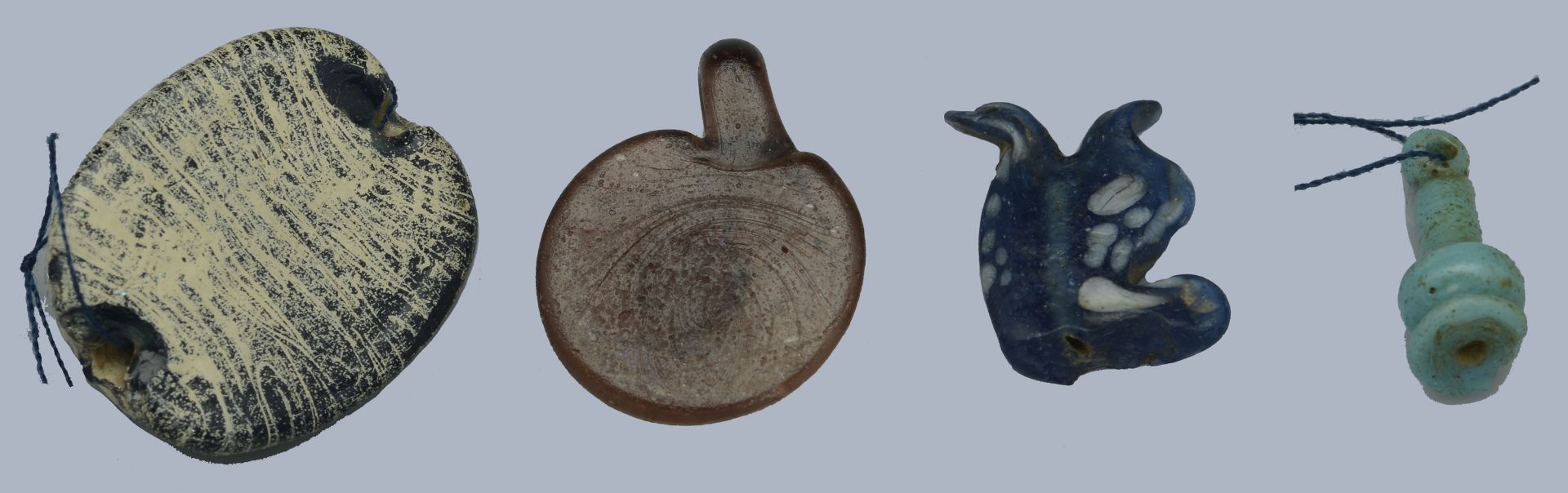 Egypt, New Kingdom (c. 1550-1069 BC), Glass (2), including blue and white Tauret amulet, 18m... - Image 2 of 2