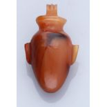 Egypt, New Kingdom (c. 1550-1069 BC), A carnelian heart amulet with side projections of arte...