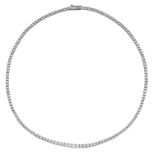A diamond line necklace, the central section claw set with a row of slightly graduating bril...