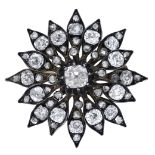 A late 19th century diamond flower brooch, set throughout with old brilliant, cushion and ro...