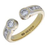 An 18ct gold diamond dress ring, the open hoop with princess-cut diamonds to either side ter...