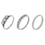 Two diamond rings, comprising a three stone ring set with brilliant-cut diamonds; a single-c...