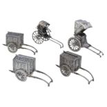 Three matching Japanese silver novelty pepperettes, modelled as wheeled palanquins, one rick...