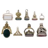 A collection of 19th century fobs, to include a gold memorial swivel fob with chalcedony pla...