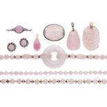 A collection of rose quartz jewellery, including bead necklaces, pendants, brooches and earr...