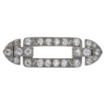 An Art Deco diamond brooch, circa 1930, of open rectangular form, with tapered terminals, se...