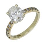 A single stone diamond ring, the oval brilliant-cut diamond, weighing 1.55 carats, in four c...