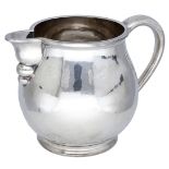 An Elizabeth II silver milk jug, of good gauge and plain design, the body lightly planished,...