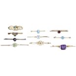 A collection of antique bar brooches and tie pins, variously set with peridot, aquamarine, b...