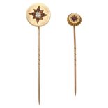 Two Victorian gold stickpins, the first with circular finial, inset with an old-cut diamond...