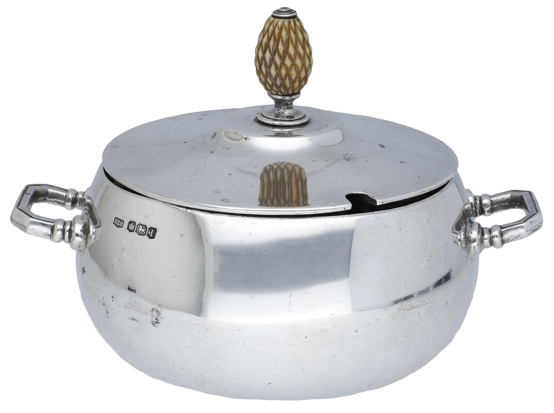 A George V silver preserve pot and cover, with pineapple finial and squat circular body with...