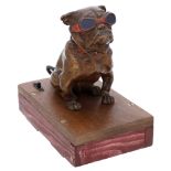 An Austrian cold painted bronze bulldog car mascot, by Carl Kauba, seated, with red collar a...