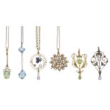 A collection of assorted pendants, circa 1900, comprising a half pearl flowerhead pendant/br...