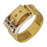 A diamond buckle ring, of two colour gold, set with three brilliant-cut diamond highlights,...
