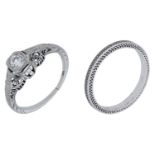 A diamond ring and band, set with an old brilliant-cut diamond in a pierced and engraved mou...
