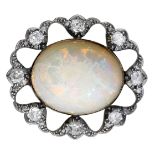 An opal and diamond brooch, circa 1890, the oval opal cabochon within an openwork surround o...