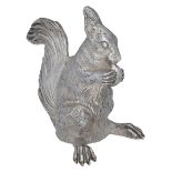 A French silver cast novelty pepperette modelled as a squirrel, eating a nut, the nut perfor...