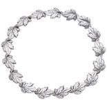 A Danish silver necklace, the articulated necklace of overlapping leaf design, stamped 'STER...
