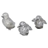 A pair of French cast silver novelty pepperettes, modelled as chicks, with open mouths, and...