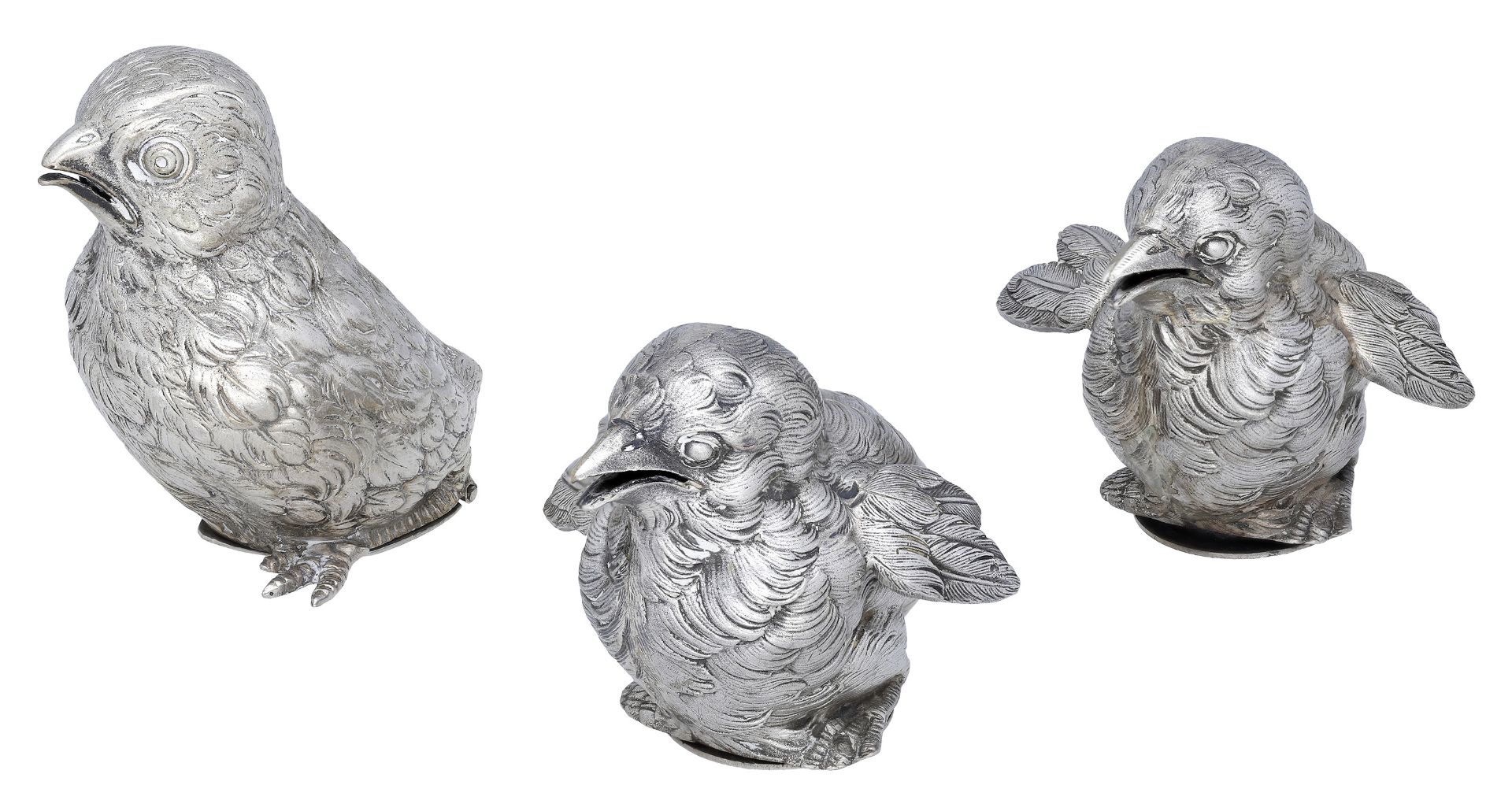 A pair of French cast silver novelty pepperettes, modelled as chicks, with open mouths, and...