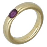 A ruby ring, the polished band tension-set with an oval-cut ruby, stamped '750', assay mark,...