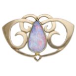 An early 20th century Art Nouveau opal doublet brooch, of whiplash scroll design and centred...