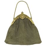 A late 19th century Austro-Hungarian mesh evening bag, the gilt frame mounted to the centre...