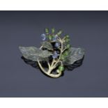 An American early 20th century Art Nouveau sapphire, peridot and enamel brooch by Marcus & C...