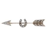 A diamond arrow brooch, the knife-edge bar intersected with a horseshoe, set throughout with...