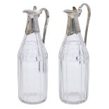 A pair of George III cruet bottles, with faceted glass bodies, the silver mounts with moulde...