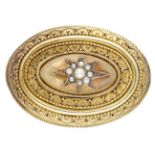 A mid 19th century gold oval brooch, the central bombÃ© section with applied half-pearl star,...
