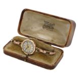 Swiss. A lady's gold wristwatch with gold expandable bracelet, circa 1920. Movement: manua...