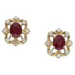 A pair of diamond and ruby ear studs, the oval mixed-cut rubies in openwork setting, with br...
