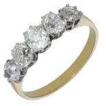 A five stone diamond ring, claw set with graduating old-cut diamonds, two colour precious me...