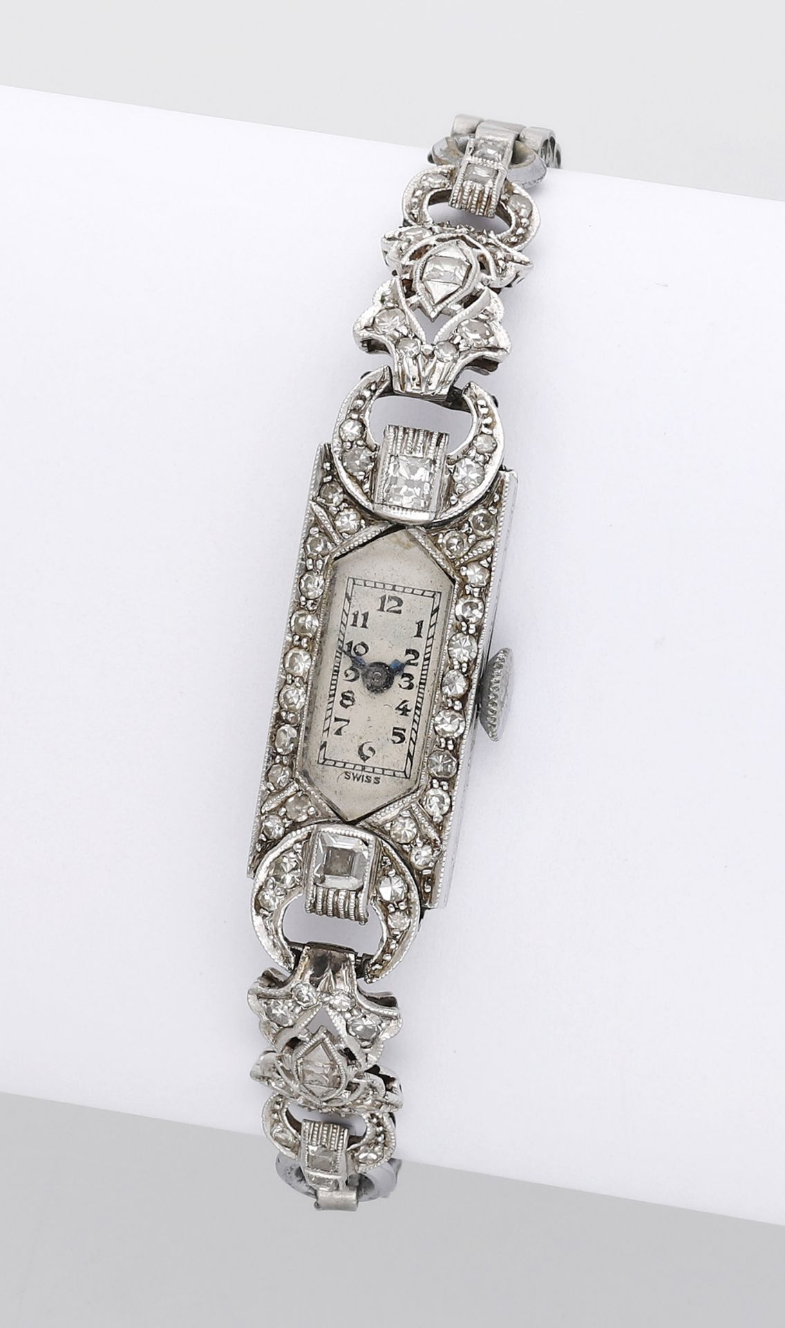 Swiss. A lady's platinum and diamond-set rectangular cocktail watch, circa 1930. Movement:...