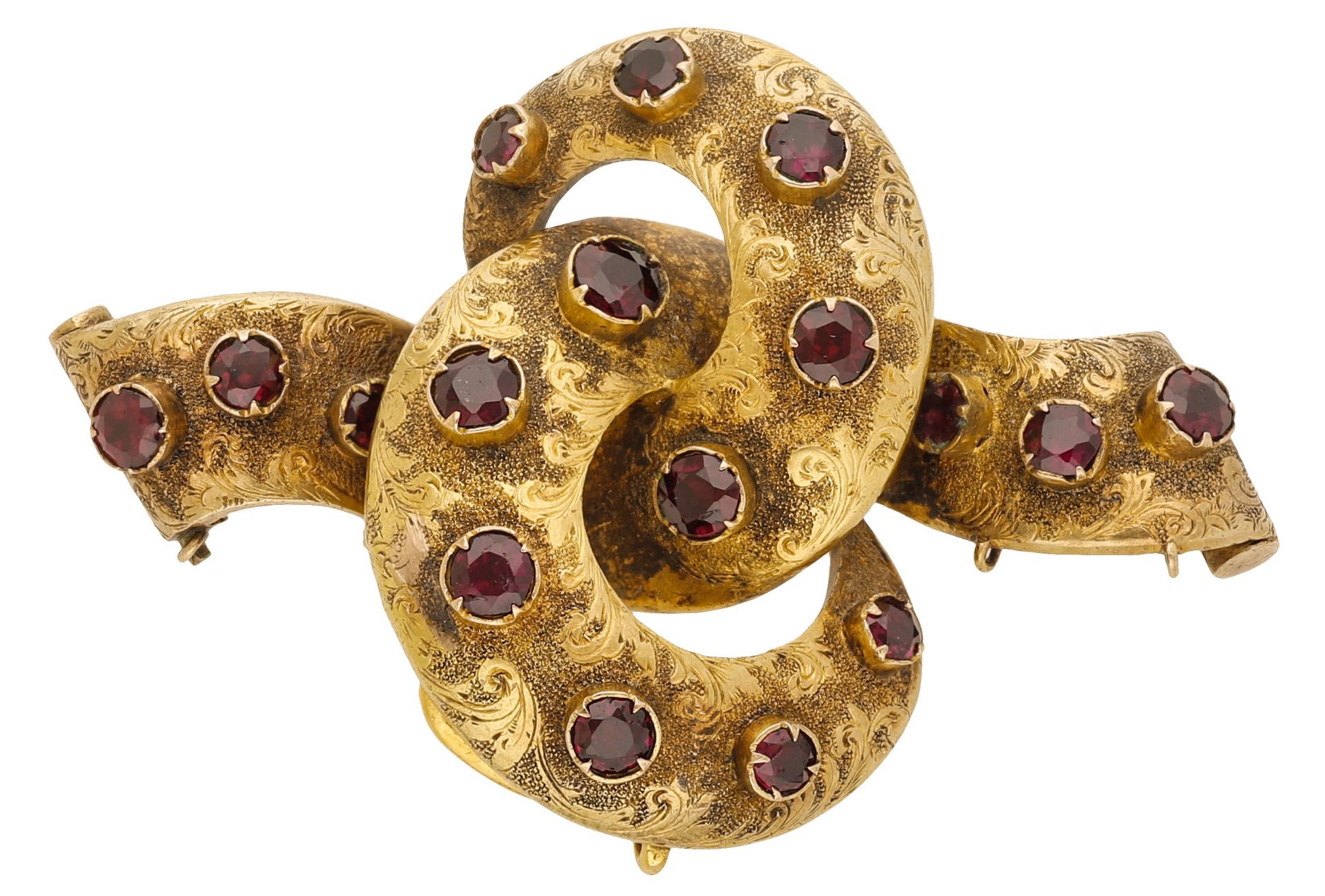 A 19th century garnet set brooch, of knot design, the front with engraved foliate decoration...