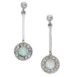 A pair of opal and diamond ear pendants, the stud surmounts suspending a knife-edge drop ter...