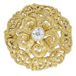 A 19th century diamond set brooch/pendant, of pierced scrollwork design, the central raised...