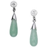 A pair of hardstone ear pendants, the polished green hardstone drops suspended by capped ter...