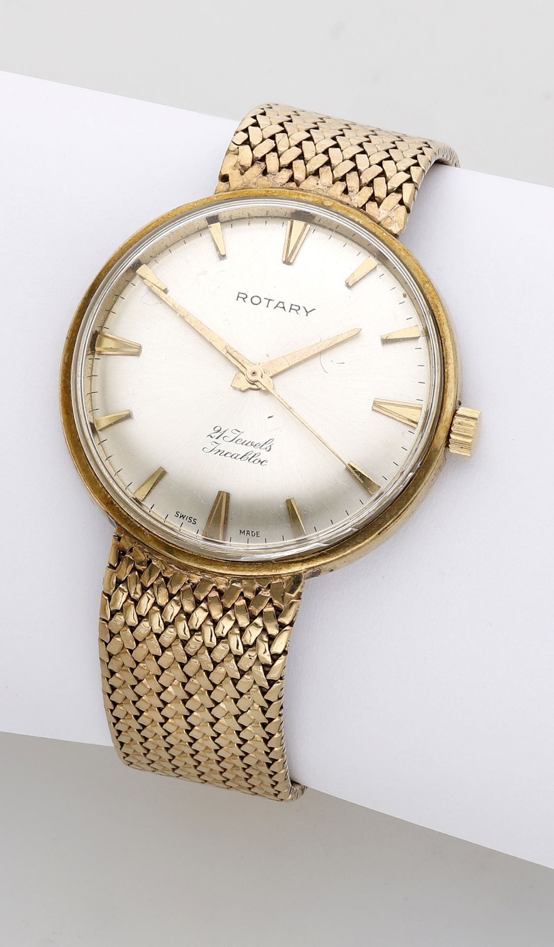 Rotary. A gold bracelet watch, circa 1960. Movement: manual winding, 21 jewels. Dial: silv...