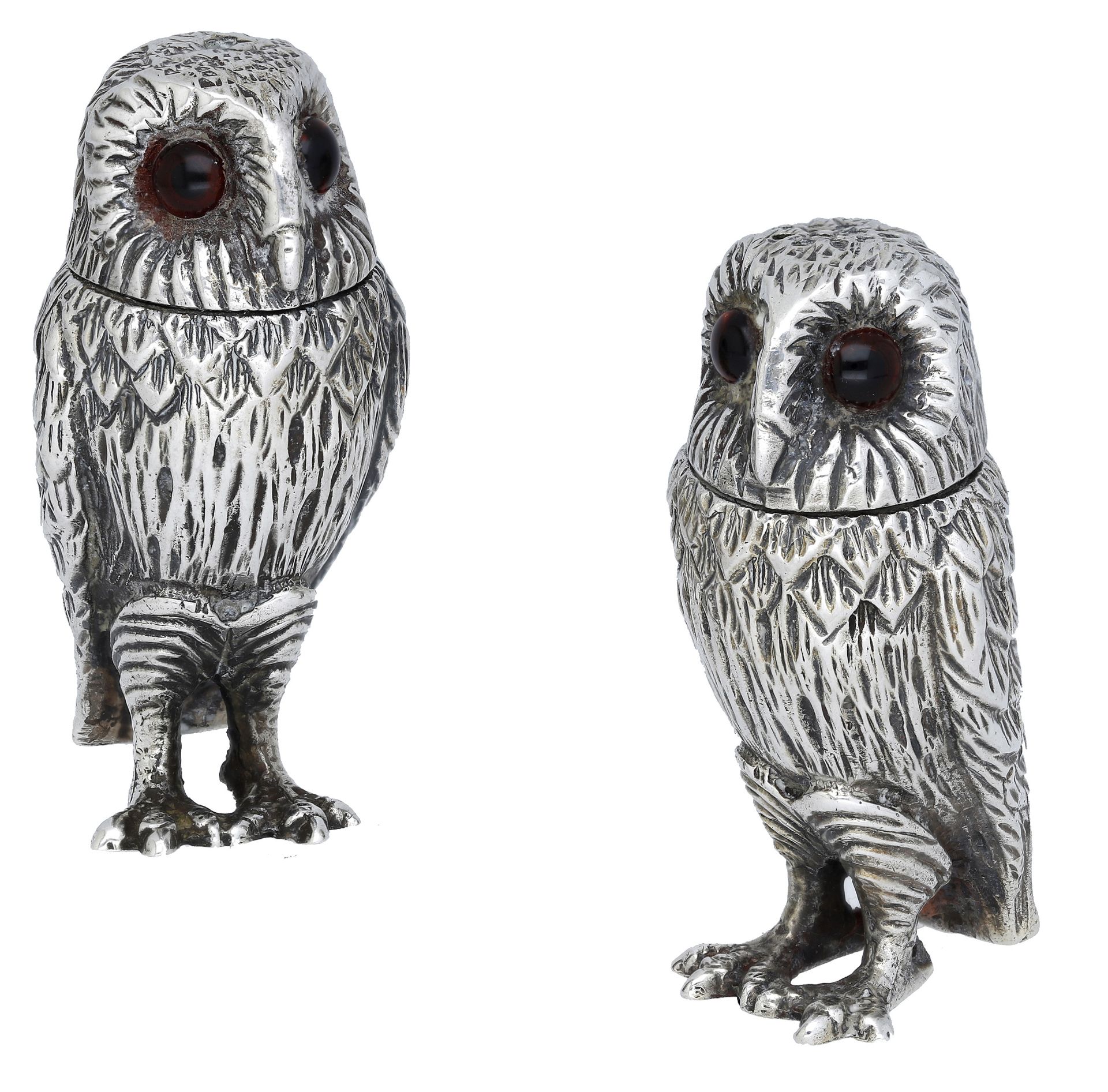 A matched pair of silver owl condiments, with detachable heads and glass cabochon eyes, the...