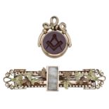 Of Masonic interest: A hardstone fob seal and a foliate brooch, the gold mounted swivel fob...