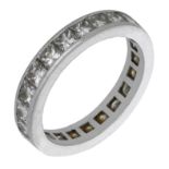 A diamond eternity ring, set throughout wit princess-cut diamonds, total diamond weight appr...
